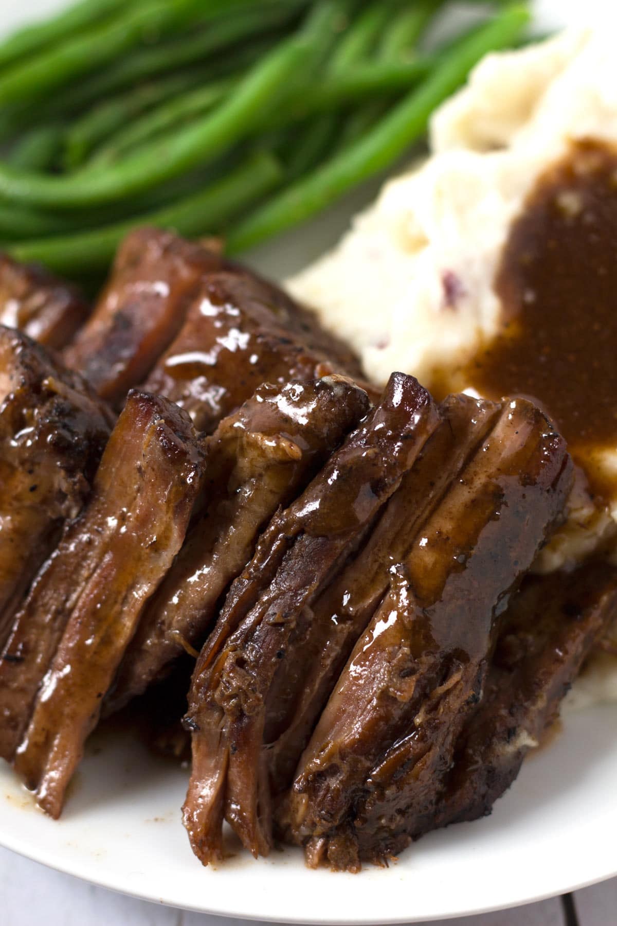 Pot Roast On Plate with Mashed Potatoes and Green Beans
