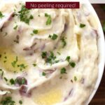 Close up of bowl of mashed potatoes with text overlay.