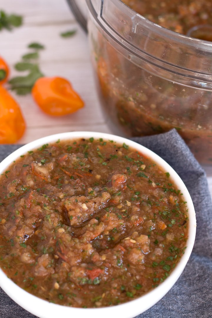 Roasted Pineapple Habanero Salsa in bowl with food processor