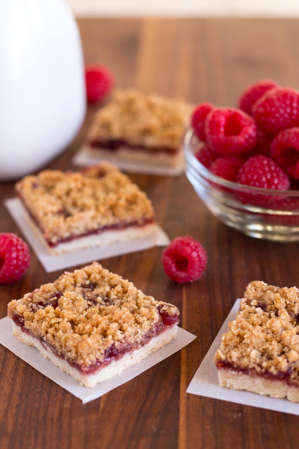 Butter crumble oat topping on raspberry bars.