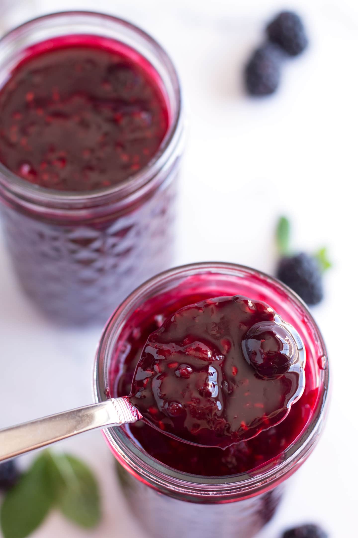 Spoonful of triple berry sauce.