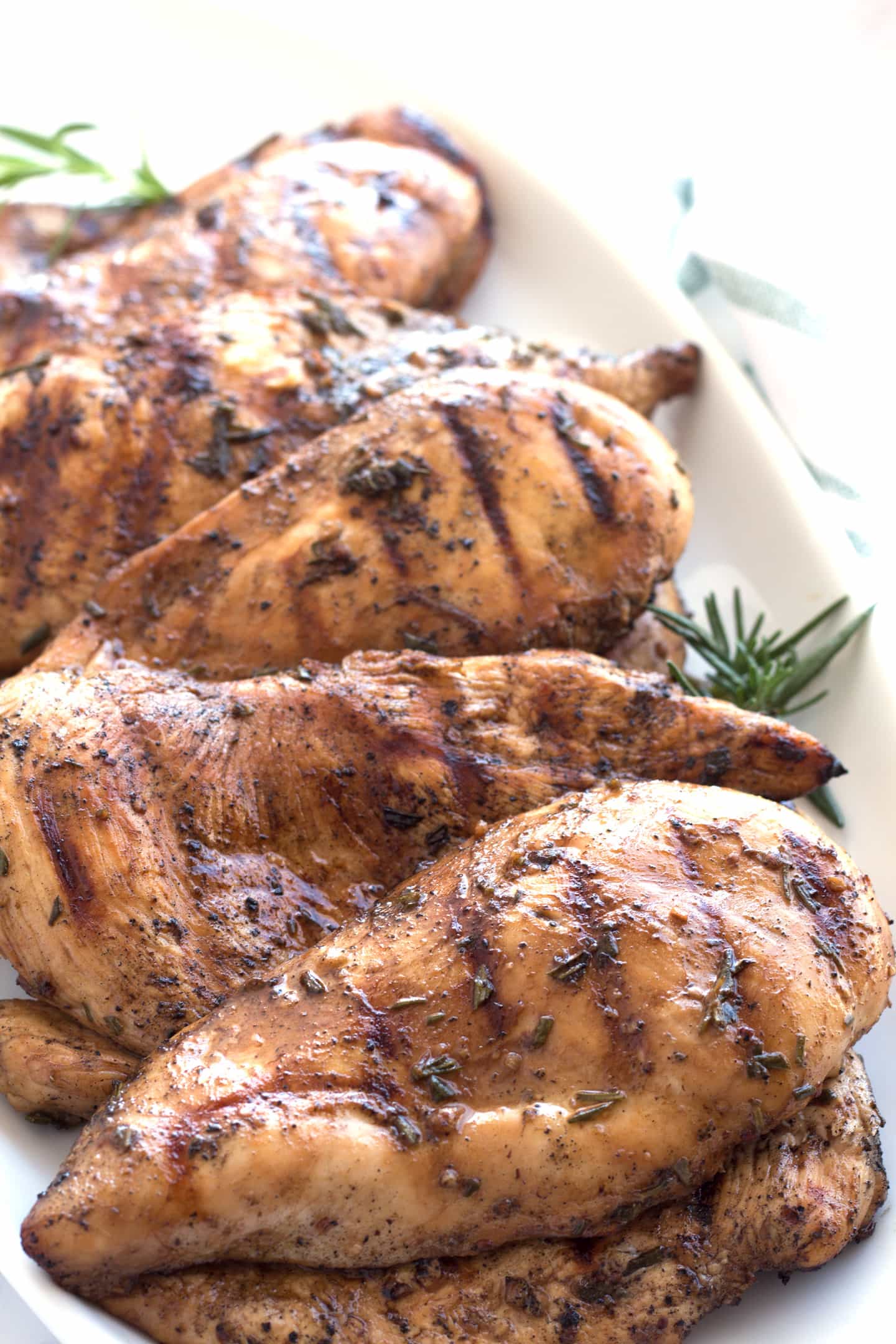 Pieces of best ever grilled chicken layered on serving tray.