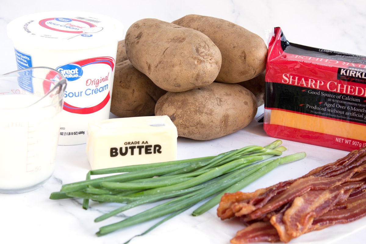 Ingredients to make potato bake with bacon and cheese.