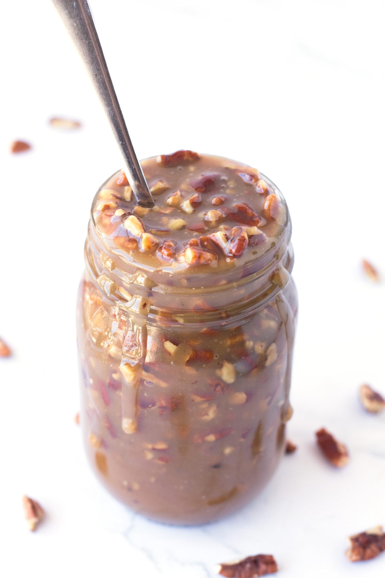 Close up of jar of Microwave Caramel Pecan Sauce