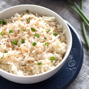 Bowl of Toasted Coconut Rice on blue plate