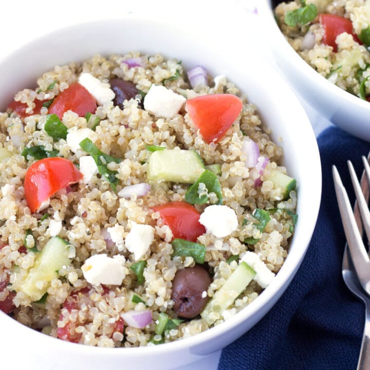 Greek Quinoa Salad with forks and napkins