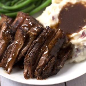 Plate of Pot Roast and green beans and mashed potatoes