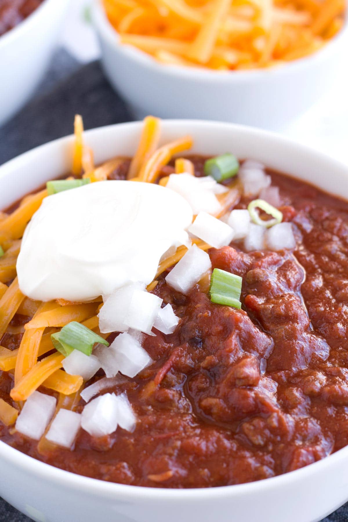 Up close bowl of chili with toppings
