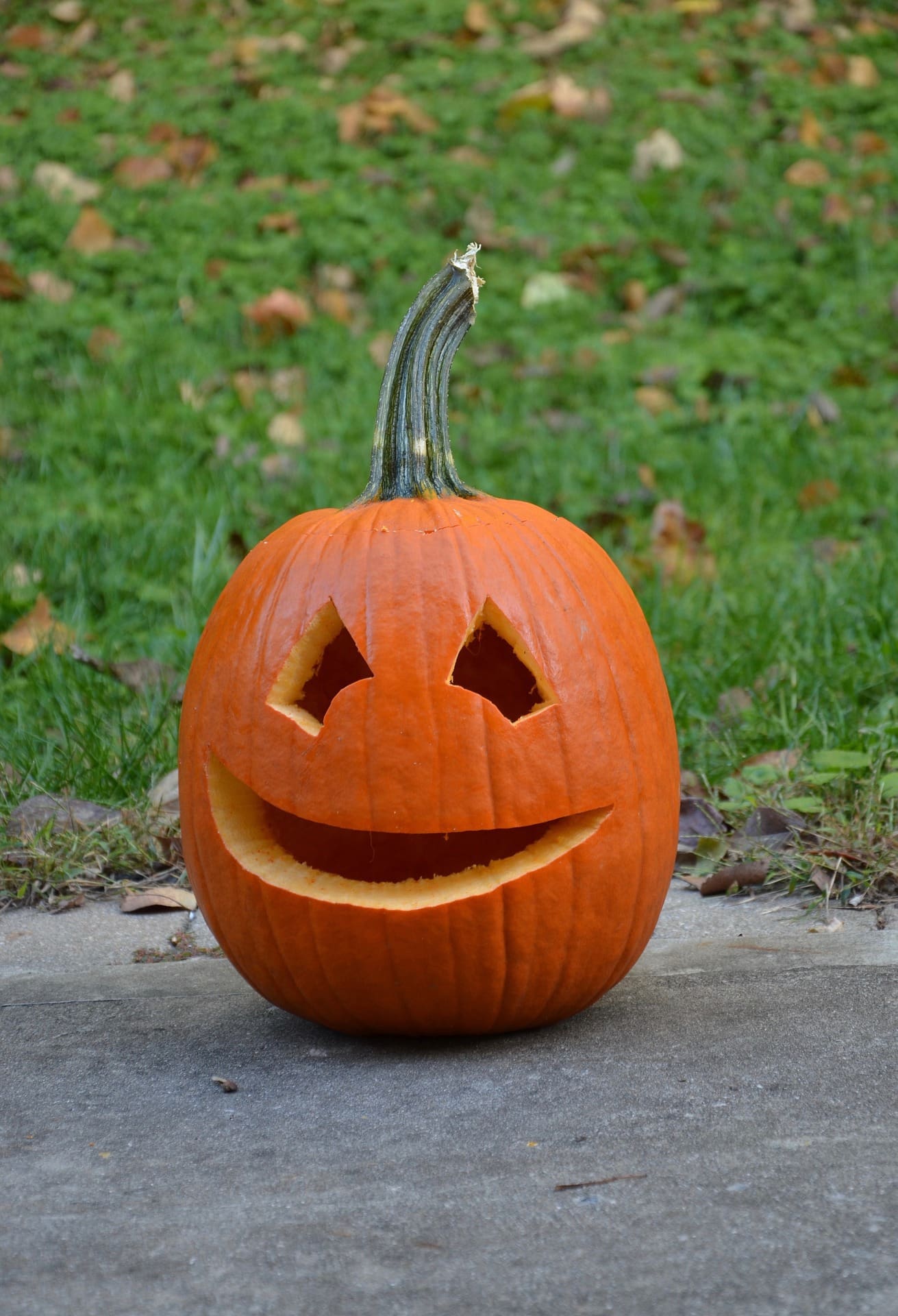 Carved pumpkin with a smiley face.