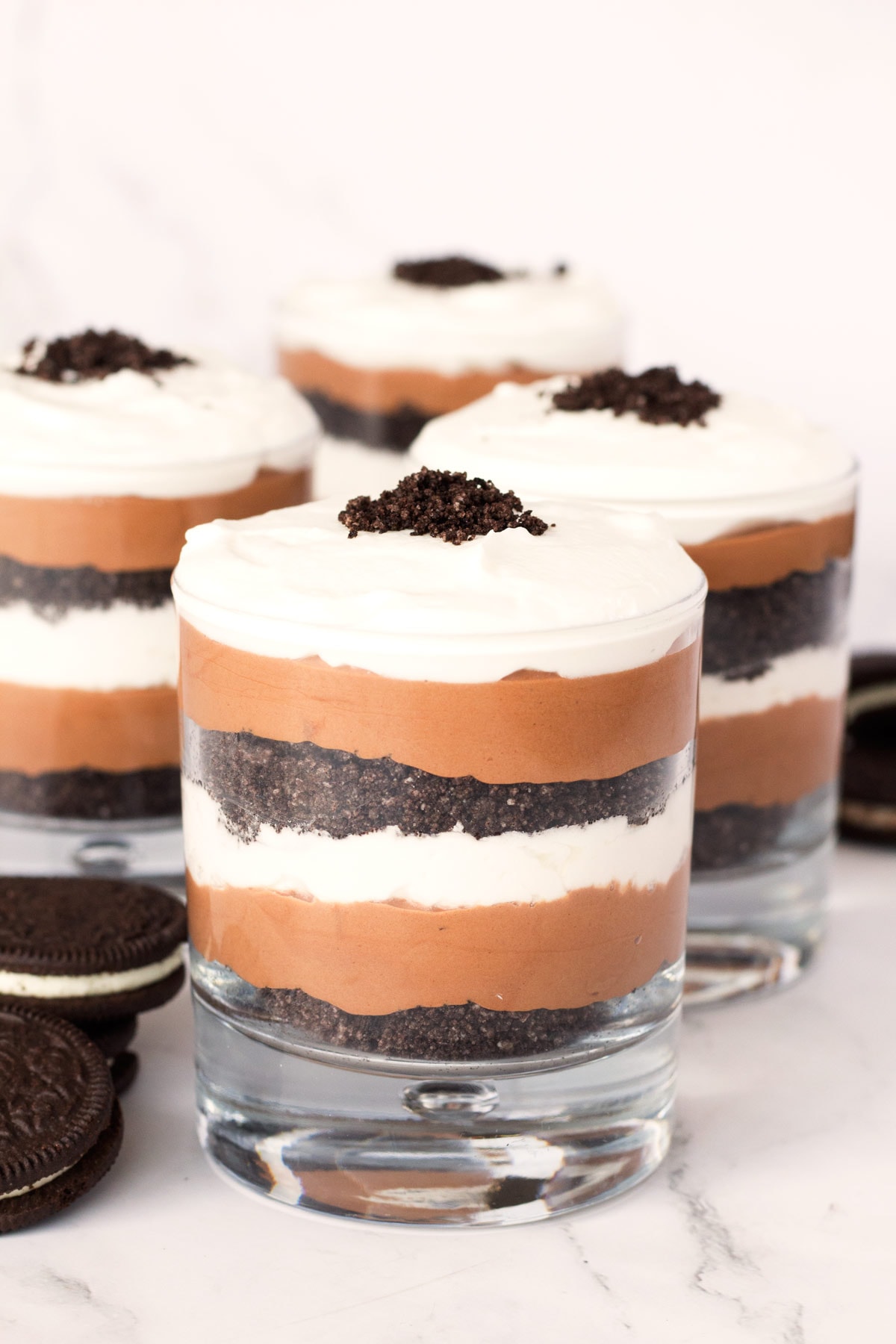 Chocolate parfait with oreo crumbs, whipped cream, and chocolate mousse.