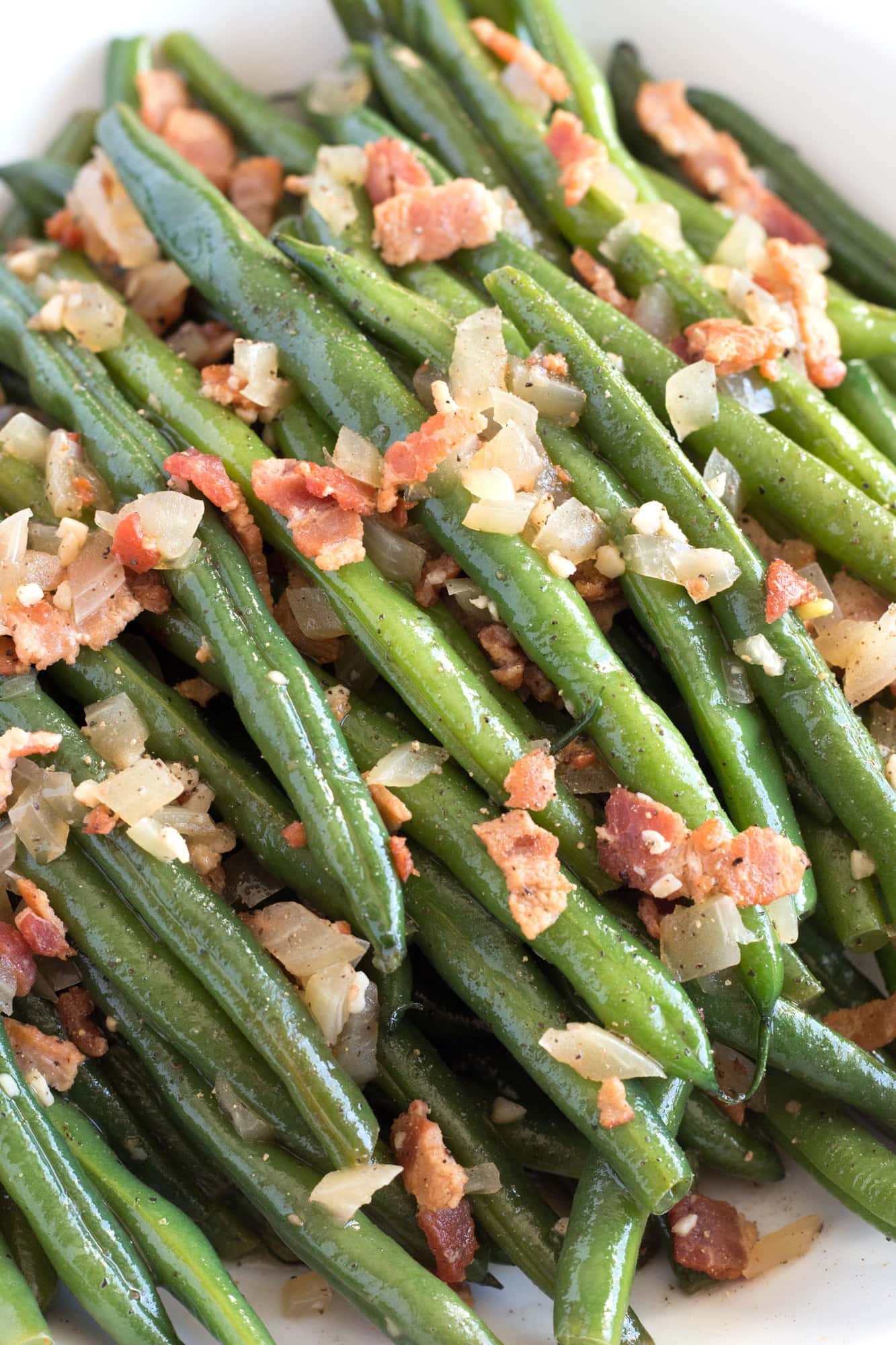 Super up close picture of Fresh Green Beans with Bacon on a serving platter.