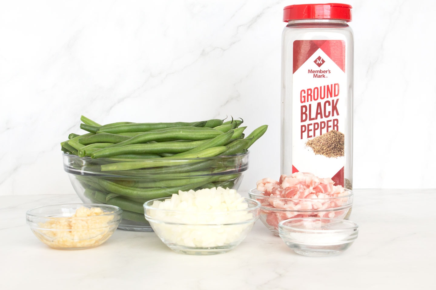 Ingredients for Fresh Green Beans with Bacon on a counter.