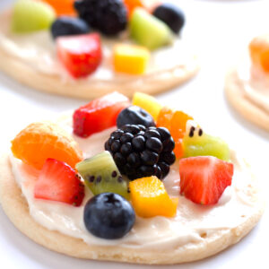 Fruit pizza cookie made with a soft and chewy sugar cookie, tangy cream cheese, and juicy fresh fruit.