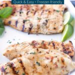 Marinated and grilled chicken on a white serving platter with limes in the background and text overlay on top.