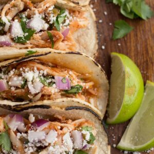 Corn tortillas filled with easy tinga sauce and chicken.