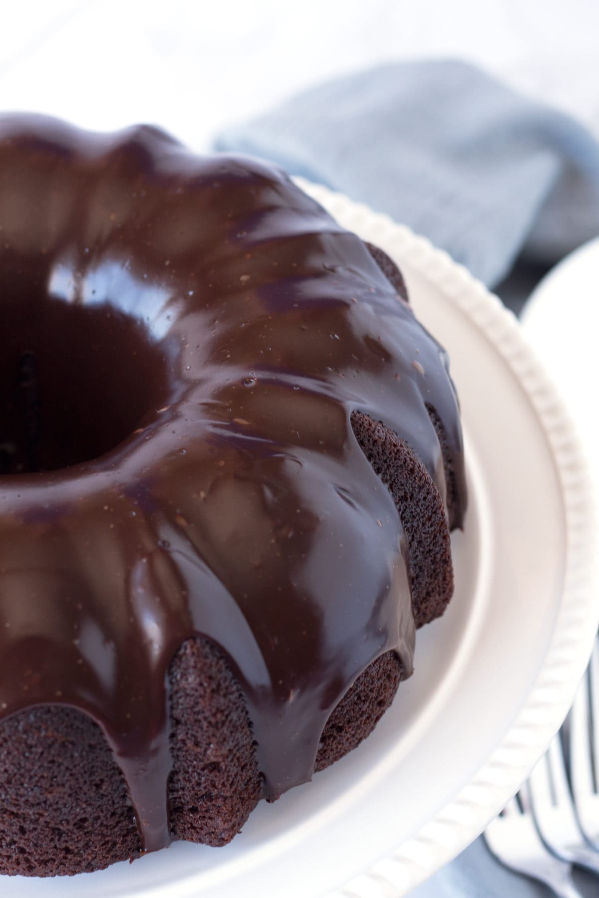 Moist chocolate bundt cake covered with chocolate ganache.