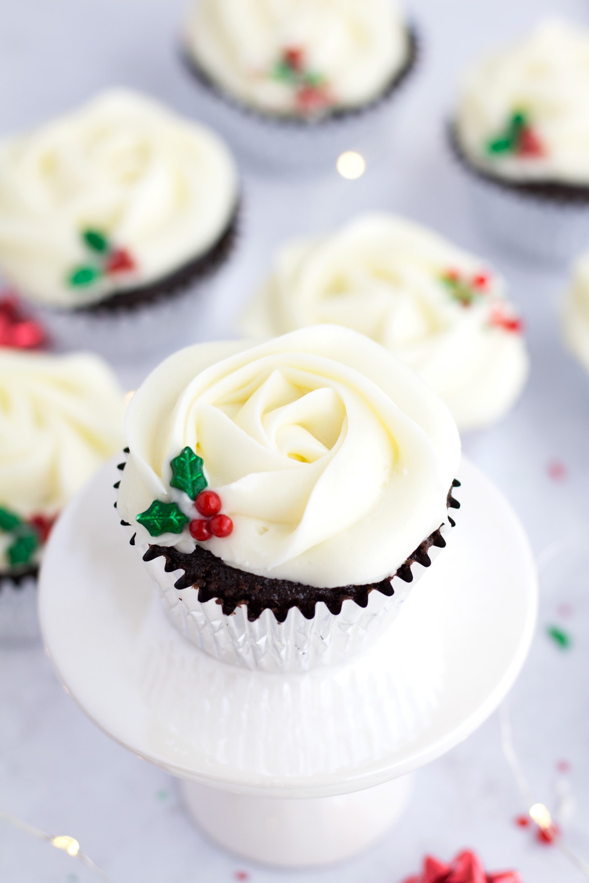 Easy Christmas cupcakes staggered in background with one in focus up front.