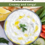 Overhead bowl of tzatziki sauce surrounded by fresh vegetables with text overlay.