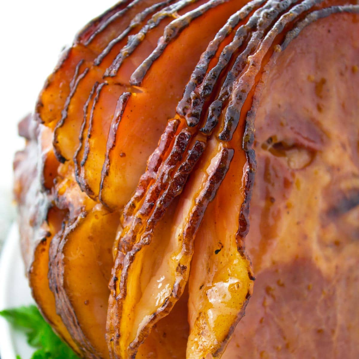 Side of glazed spiral ham cooked in a roaster.