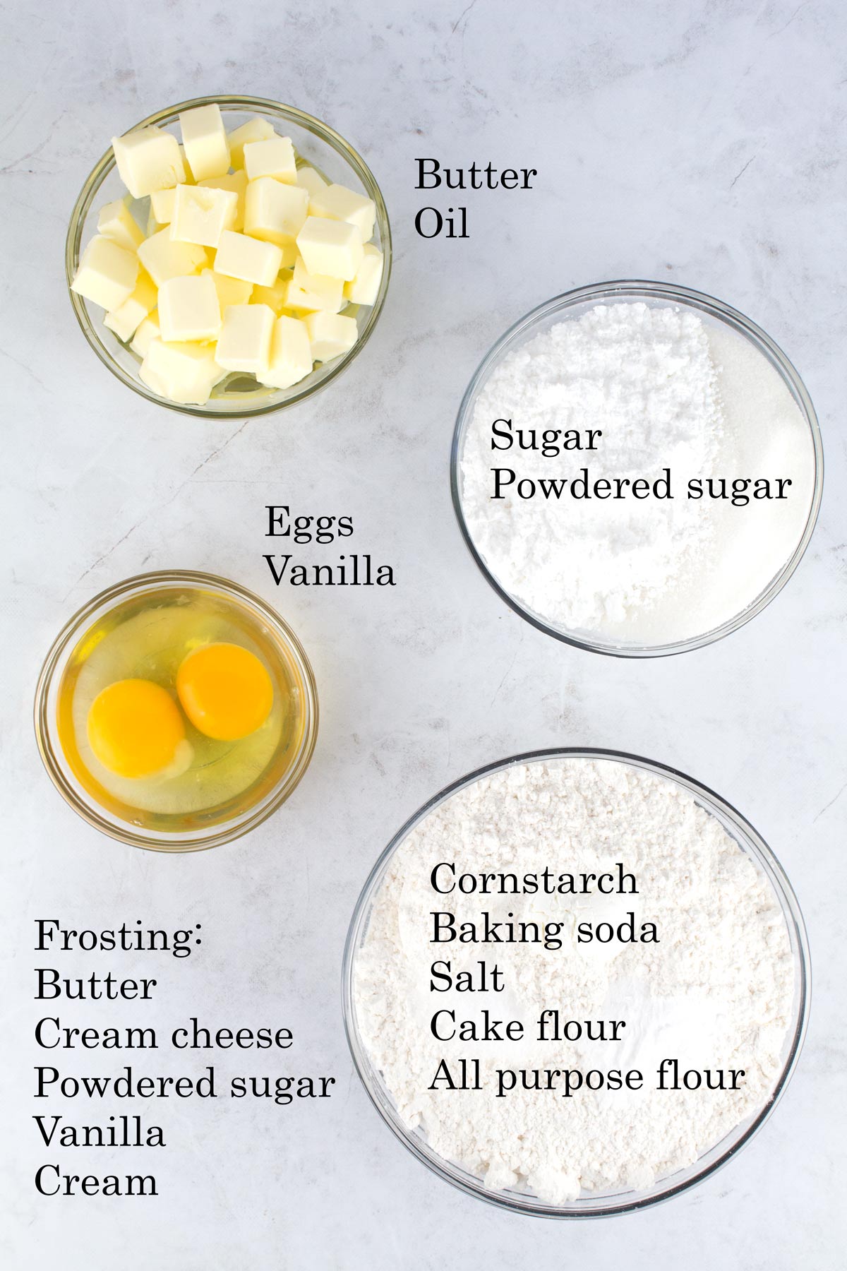Ingredients for soft sugar cookies on marble counter with text labels.