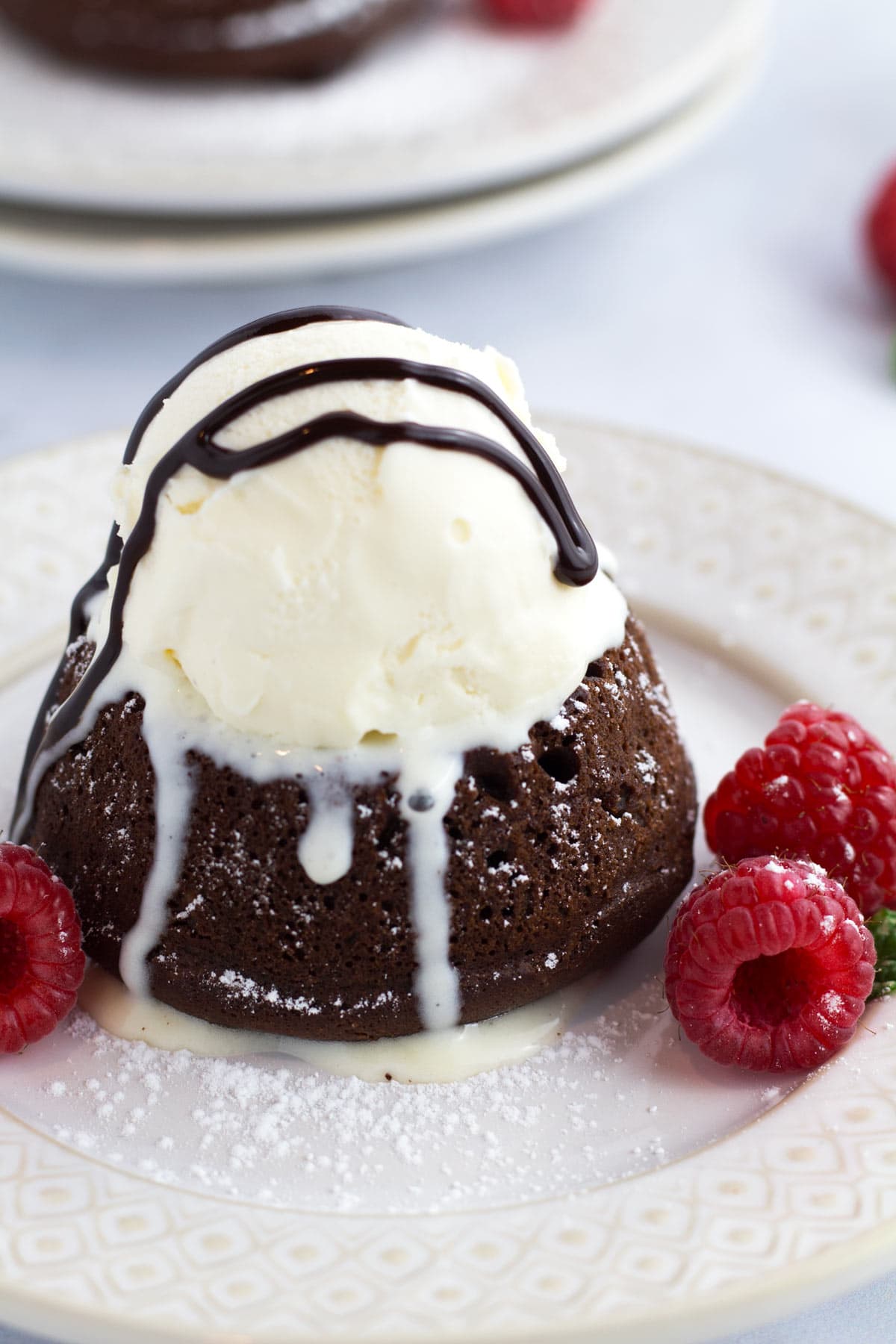 Scoop of ice cream on warm chocolate lava cake.