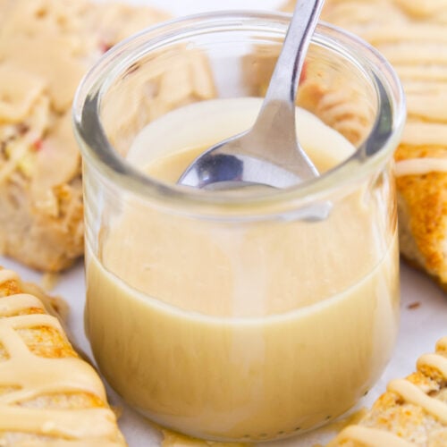 Spoon in jar of maple glaze.