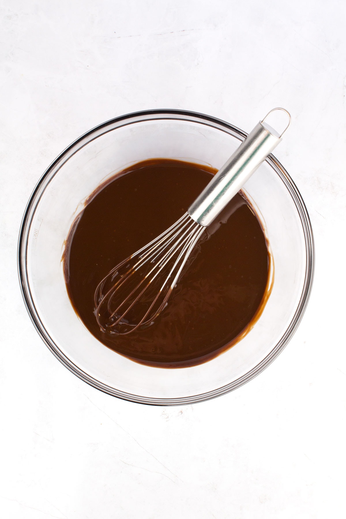 Chocolate mixture whisked together in a bowl.