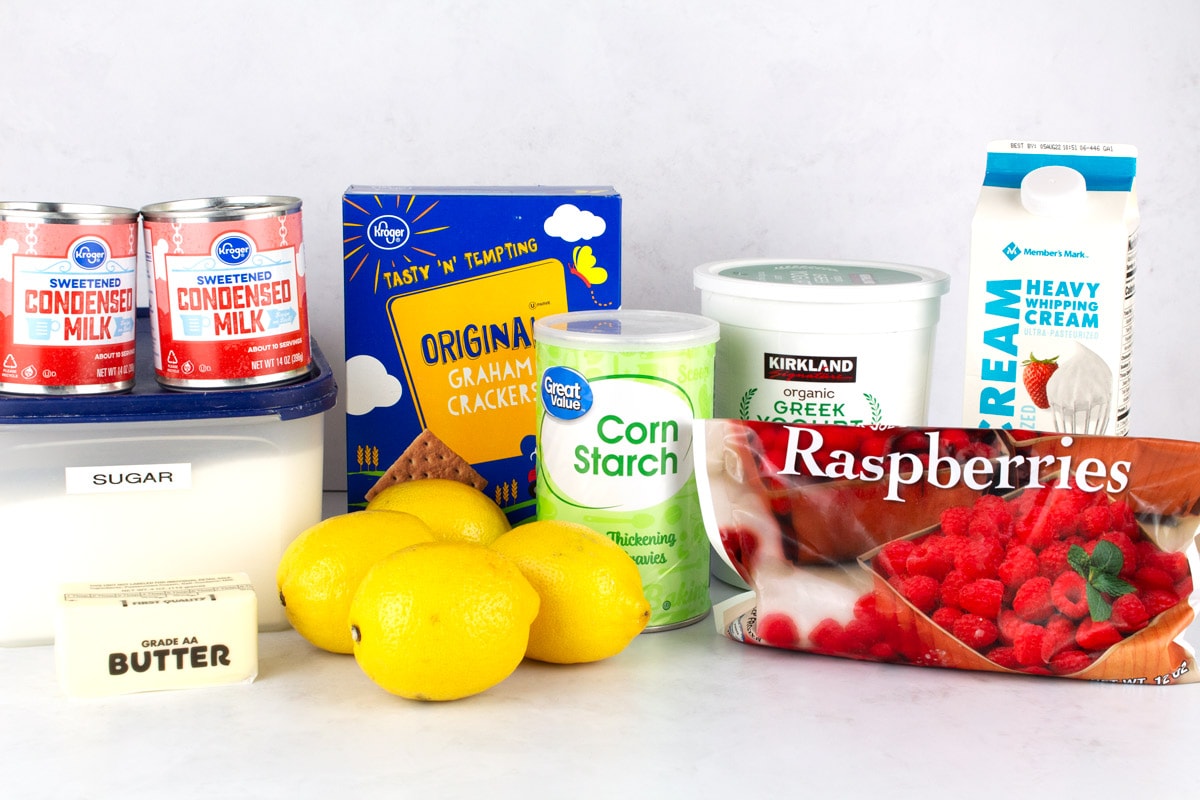 Ingredients for lemon pie recipe on white countertop.