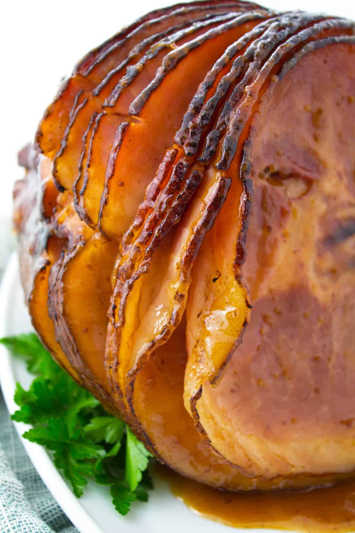 Spiral ham that's been cooked in a roaster and set on a platter.