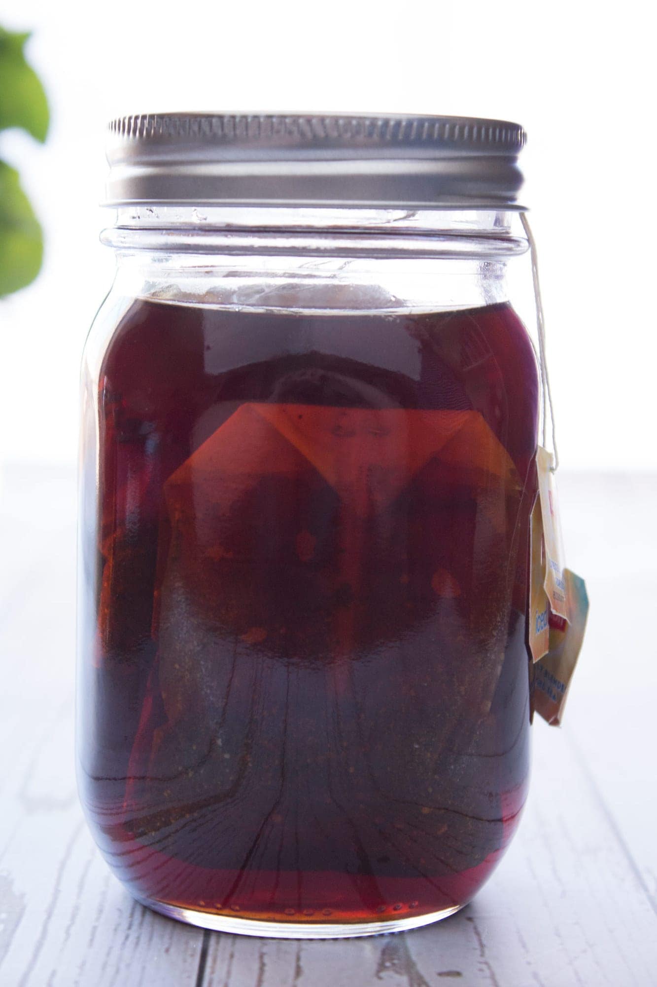 Jar of tea concentrate after steeping in the sun