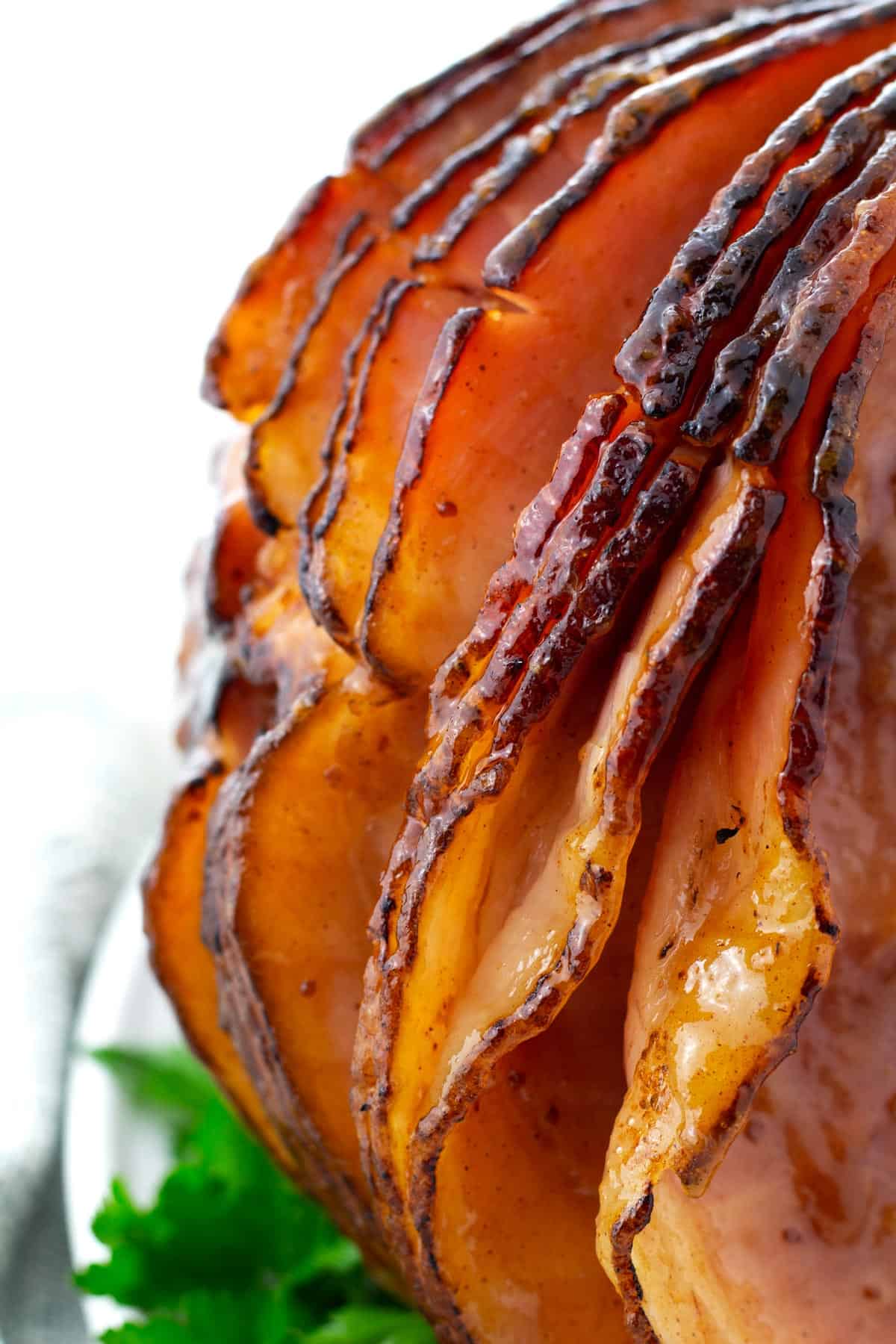 Close up of the edge of a spiral ham with pineapple brown sugar glaze.