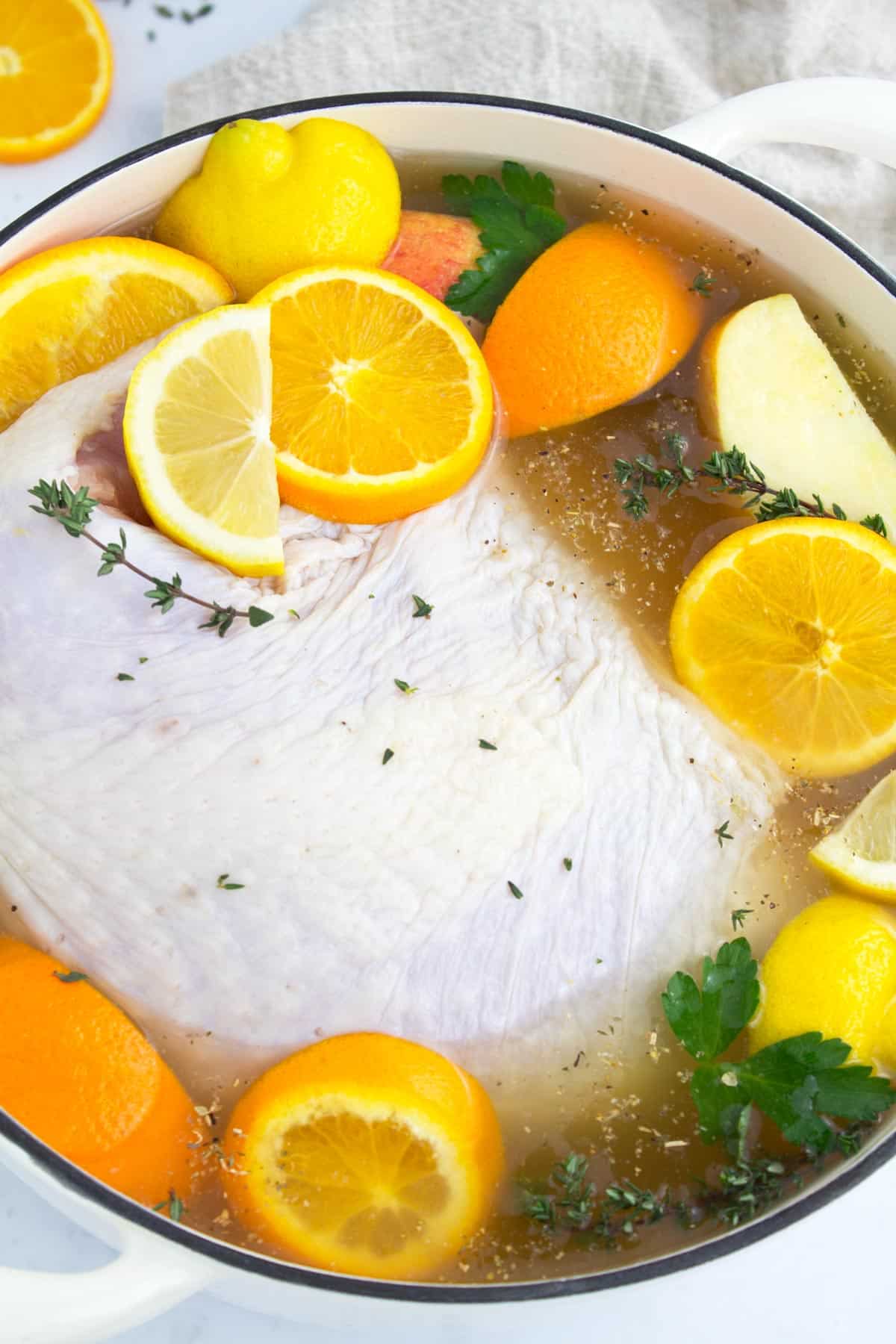 Bright citrus and sweet apple juice in turkey breast brine with fresh herbs.