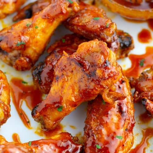 Spicy hot honey sauce drizzled on baked chicken wings.