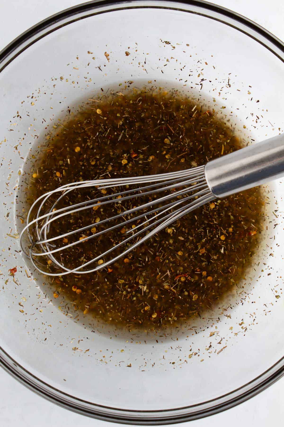 Hot honey dressing mixed together in bowl.