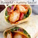 Easy chicken wrap cut in half and stacked with graphic overlay.