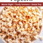 Hot honey popcorn in serving bowl with graphic overlay.