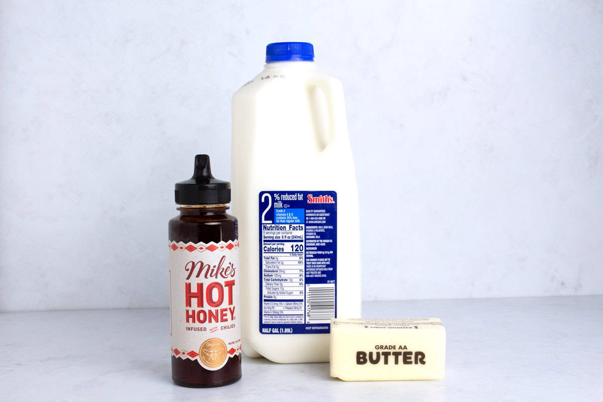 Three simple ingredients for hot honey butter on counter.