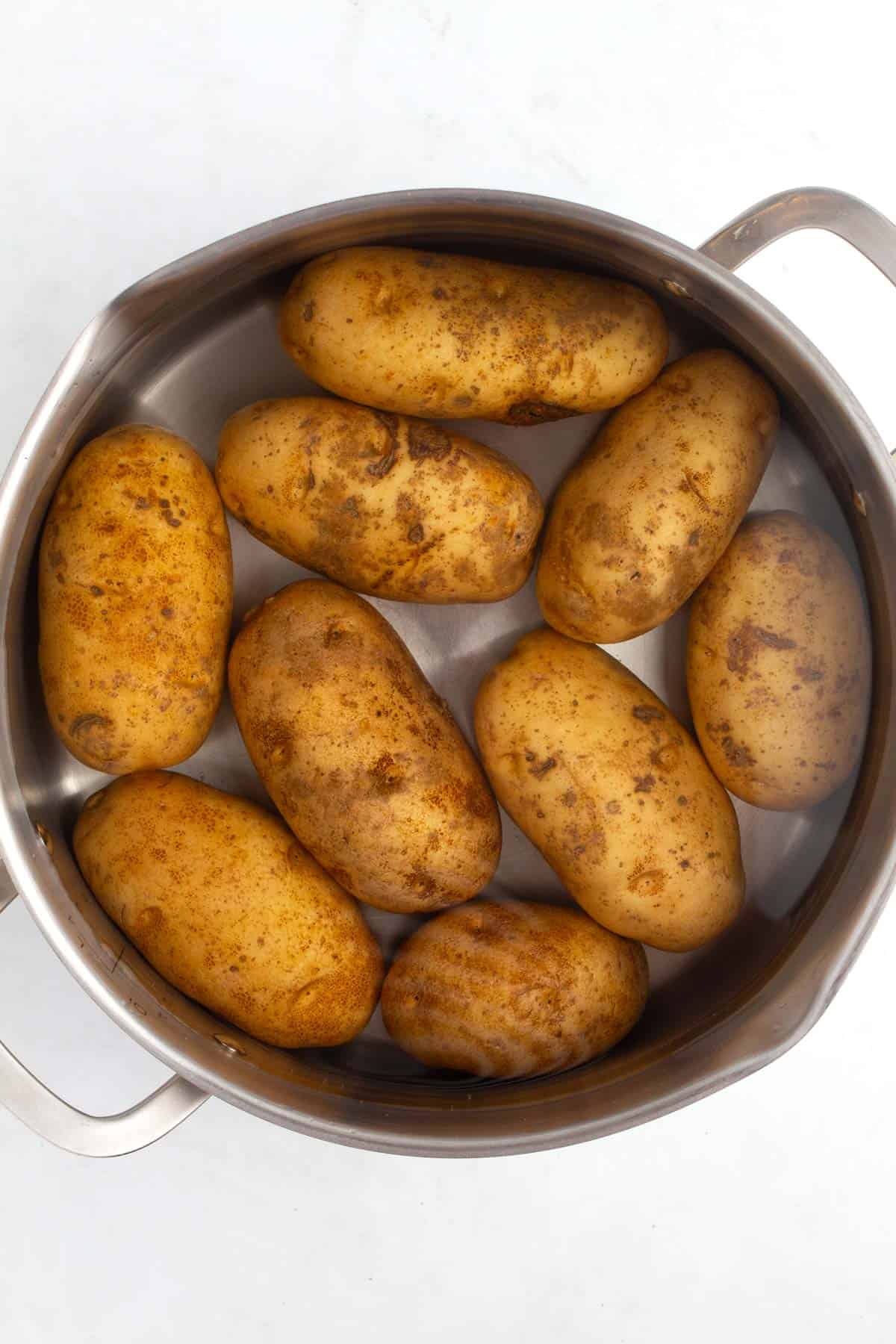 Potatoes in a pot with water for boiling.