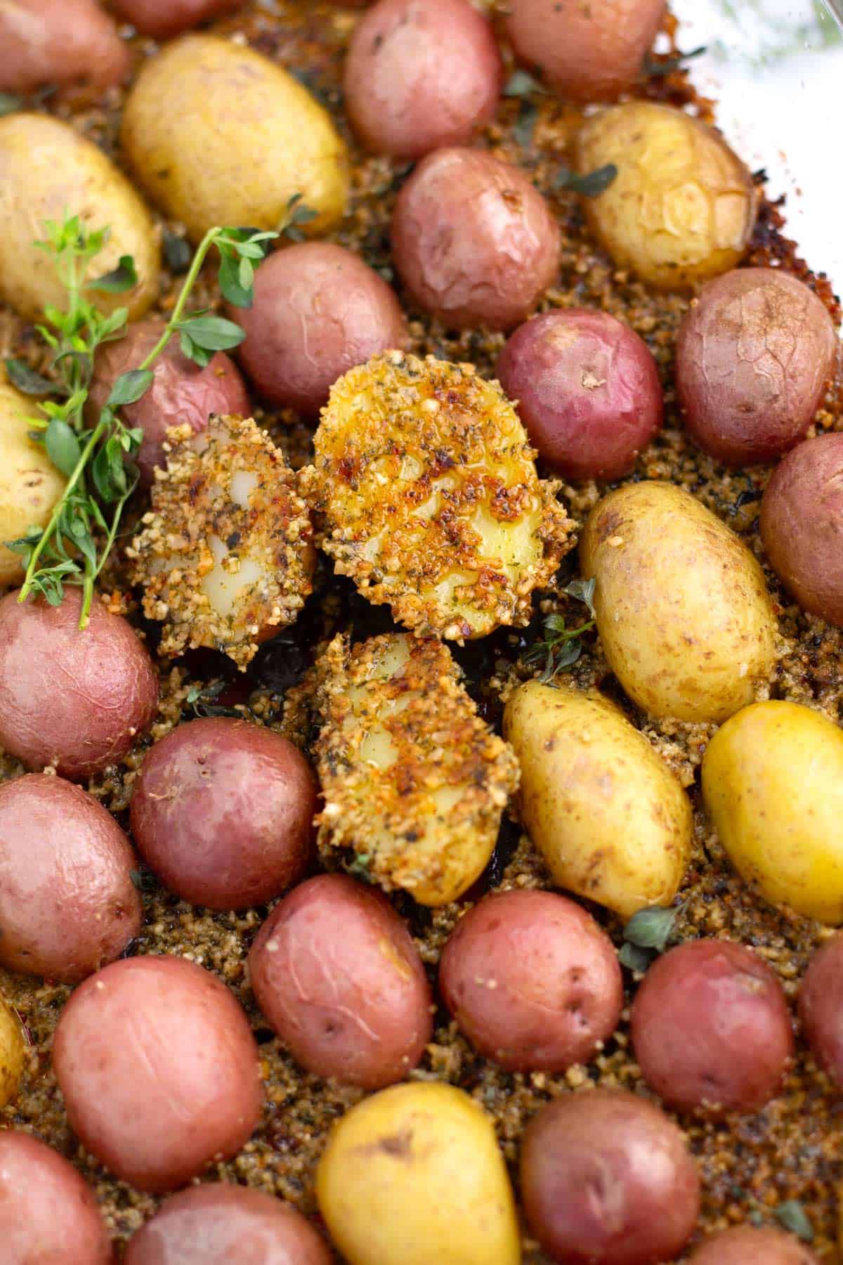 Deeply golden Parmesan crust on baby potatoes after roasting in baking dishes.