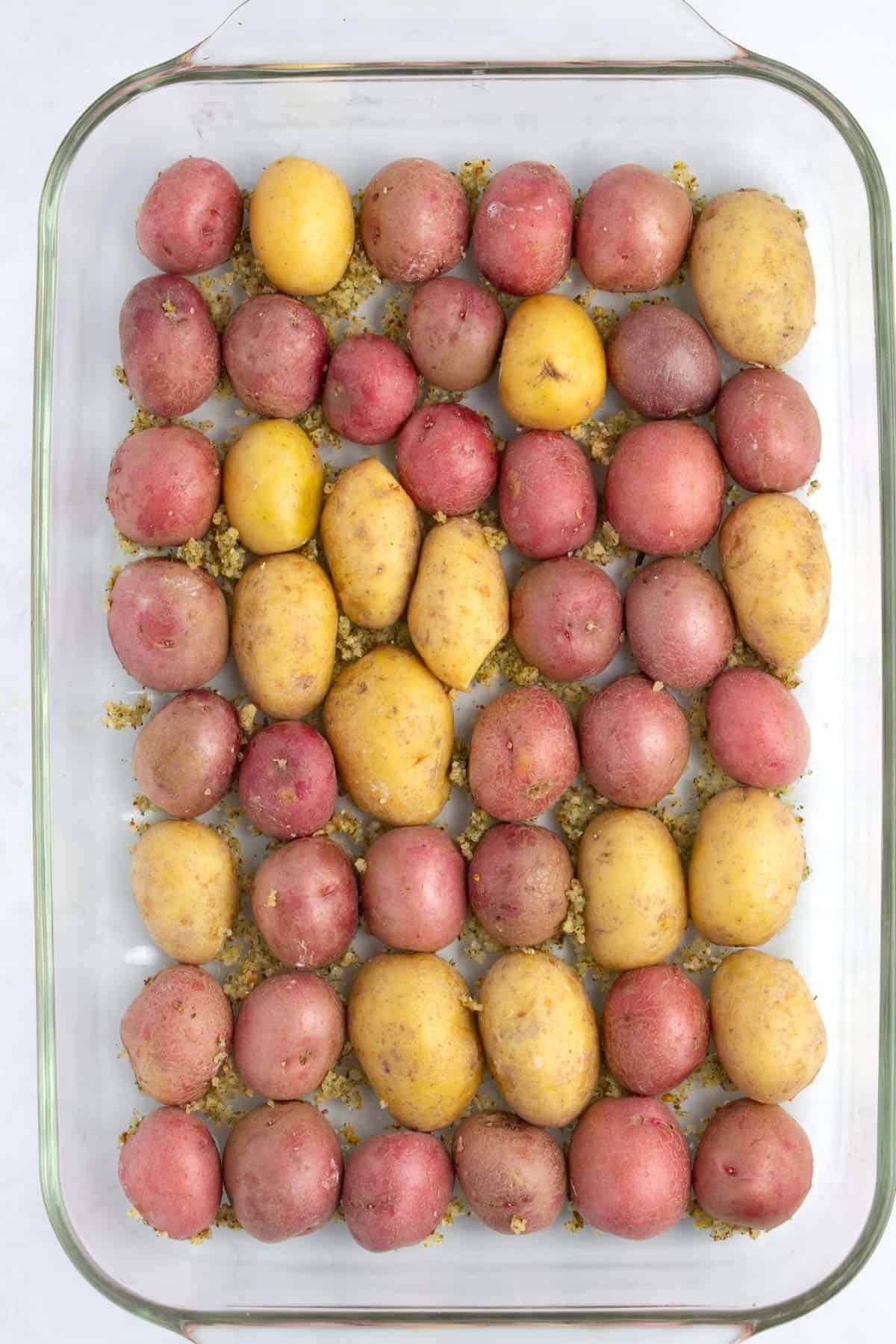 Baking dish of baby potatoes before roasting.