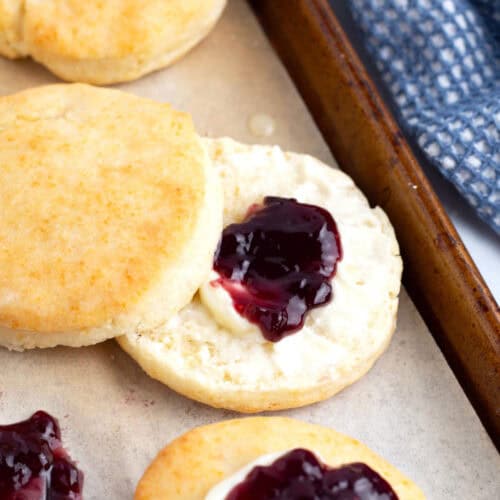 Easy tender cream biscuits covered with butter and jam.