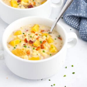 Bowls of potato corn chowder on counter.