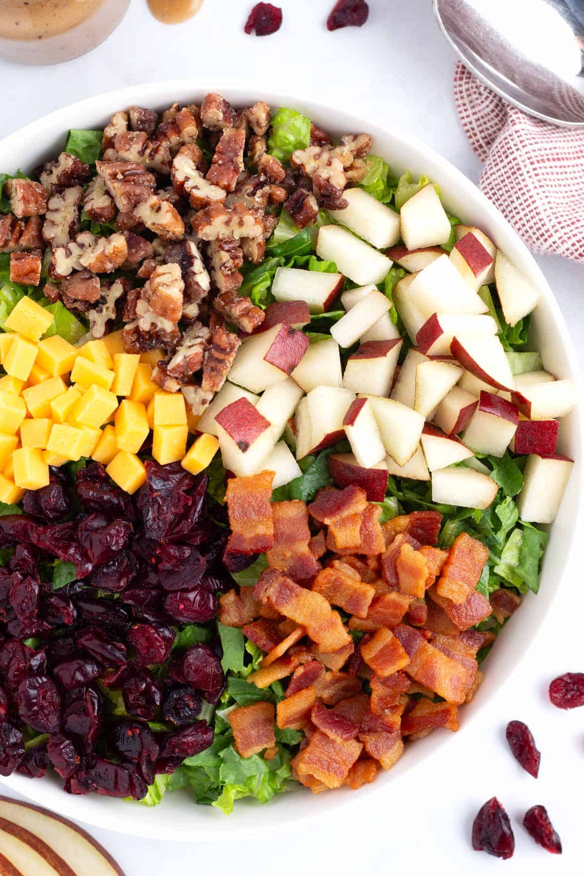 Delicious red pear salad topped with all the tasty toppings.