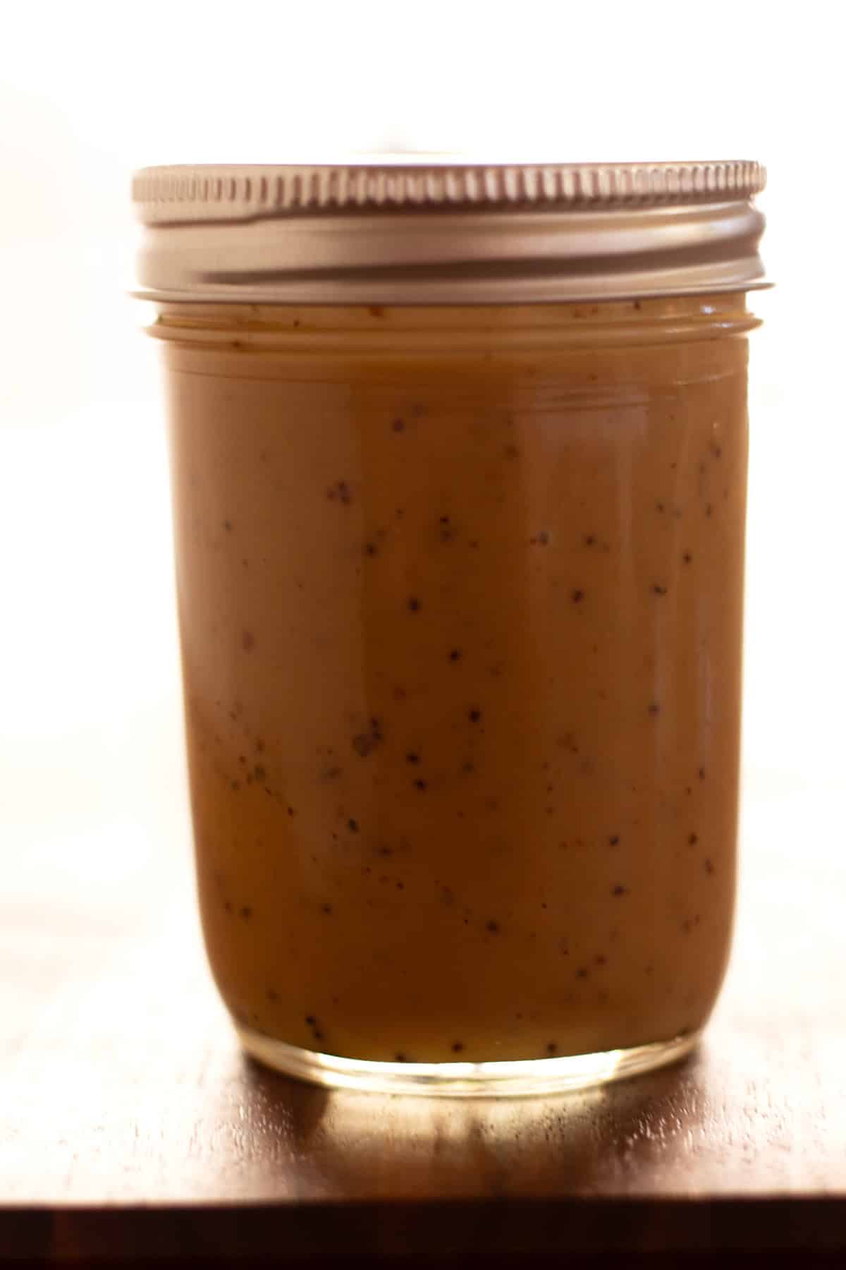 Finished creamy, sweet balsamic dressing in jar after mixing together.