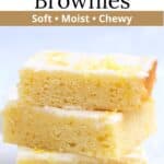 Soft and fudgy lemon brownies stacked on each other with graphic overlay.