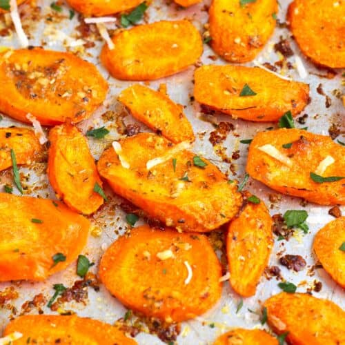 Sliced carrots tossed in butter and parmesan and roasted until crispy edges and tender centers.