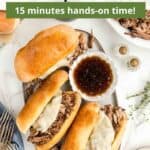 A serving platter with three chuck roast sandwiches and dip with a green graphic overlay.