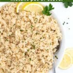 Delicious lemon rice topped with sliced lemons in a bowl with a spoon and green text overlaid at the top.