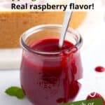 A glass jar of raspberry cheesecake sauce with drips on the side and a graphic overlay of green text.