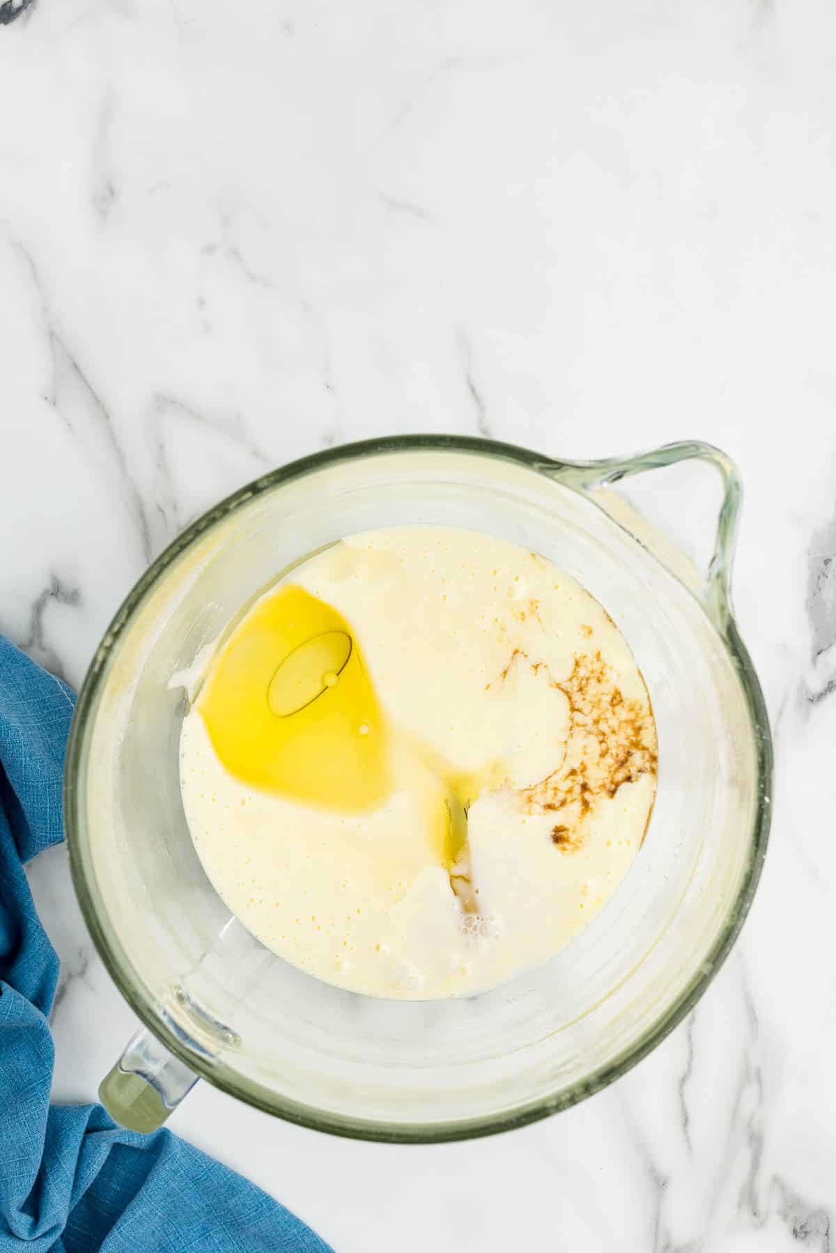 A mixing glass with added ingredients in the cake batter.